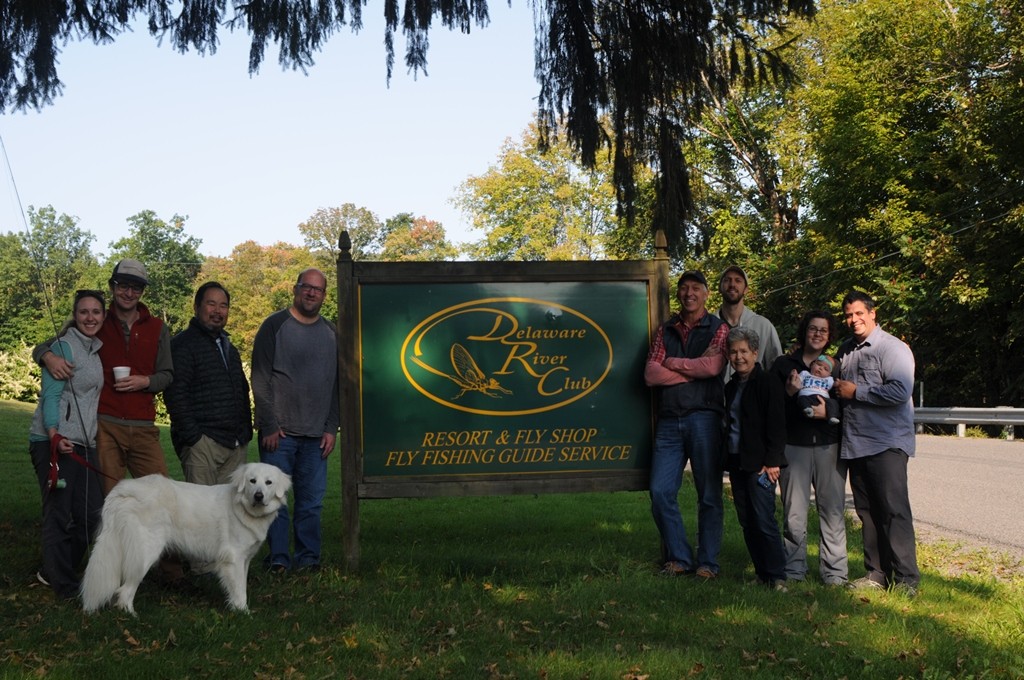 Group photo of the 2017 group in front of the Delaware River Club sign.